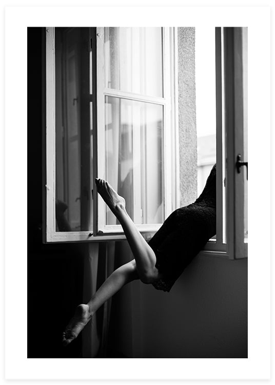 woman leaning on open window in black and white poster